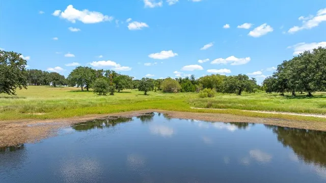 a view of a lake and a yard