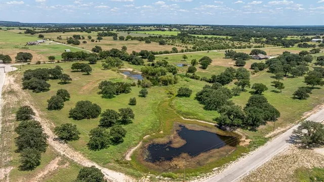 a view of a lake with houses in the background