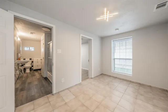 a view of a livingroom with a hall and a window