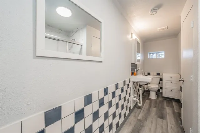 a view of a bedroom with furniture