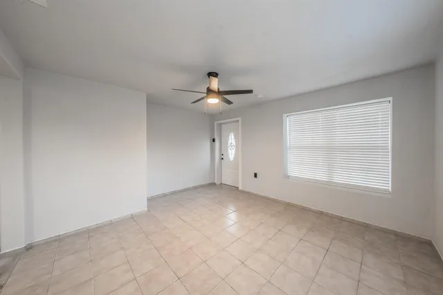 a view of an empty room with a window