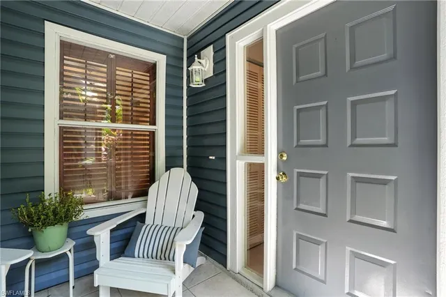 a view of a chair and table in the balcony