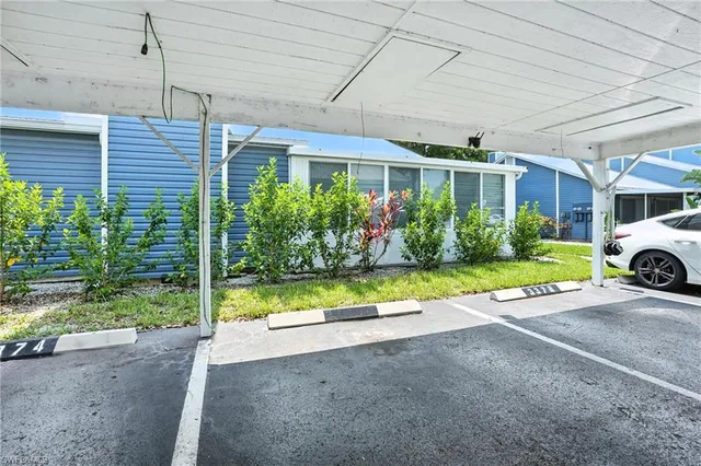 a view of a house with a garden and pathway