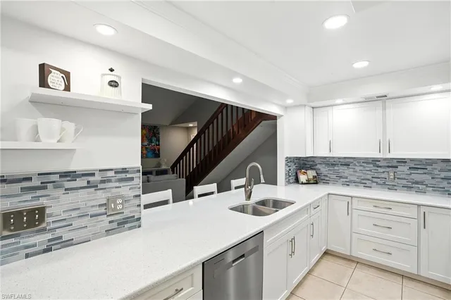 a kitchen with sink cabinets and stove