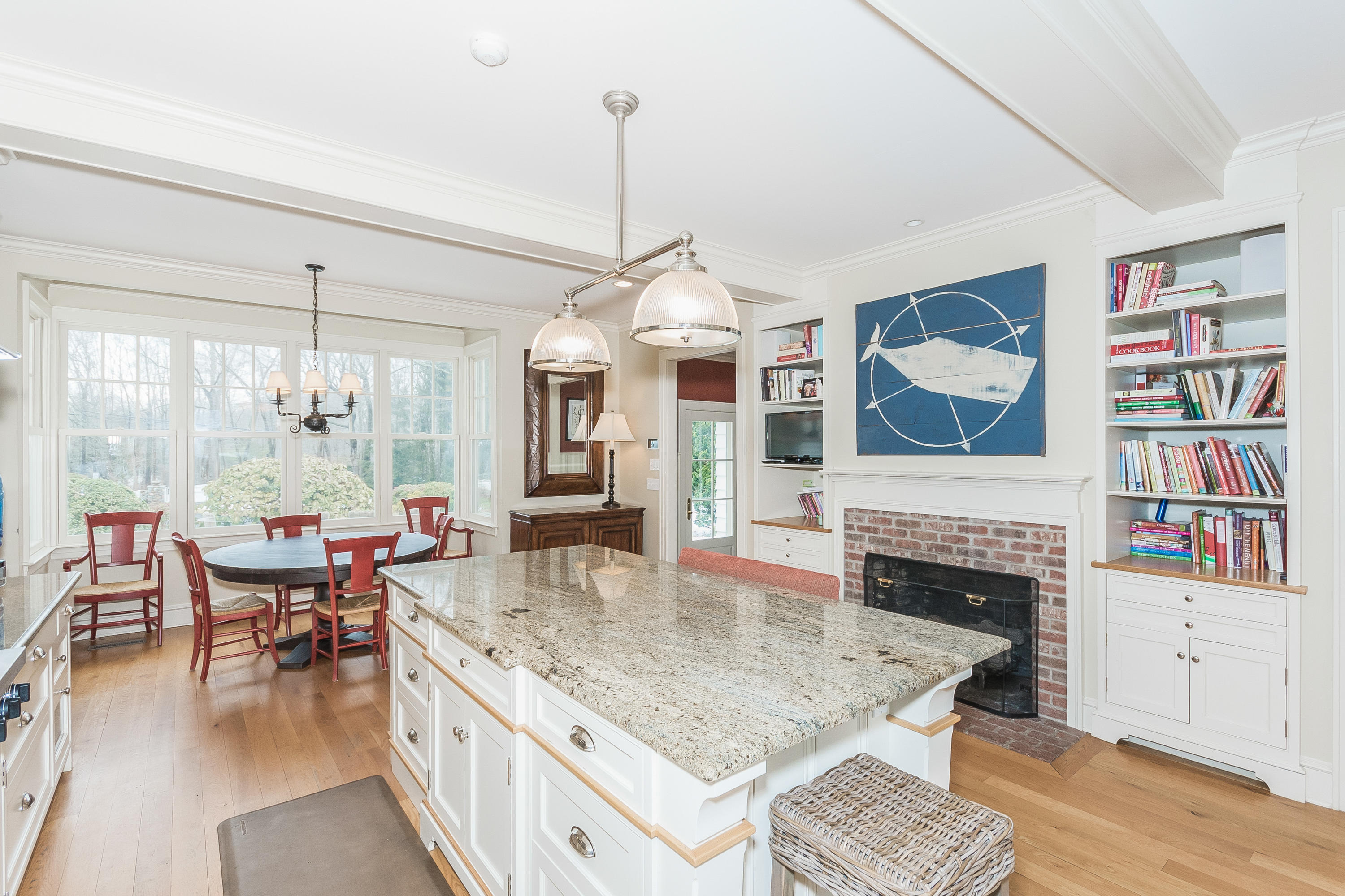 370 Wahackme Road New Canaan, CT 06840 - Photo 12 of 35 a dining room with furniture a chandelier and wooden floor