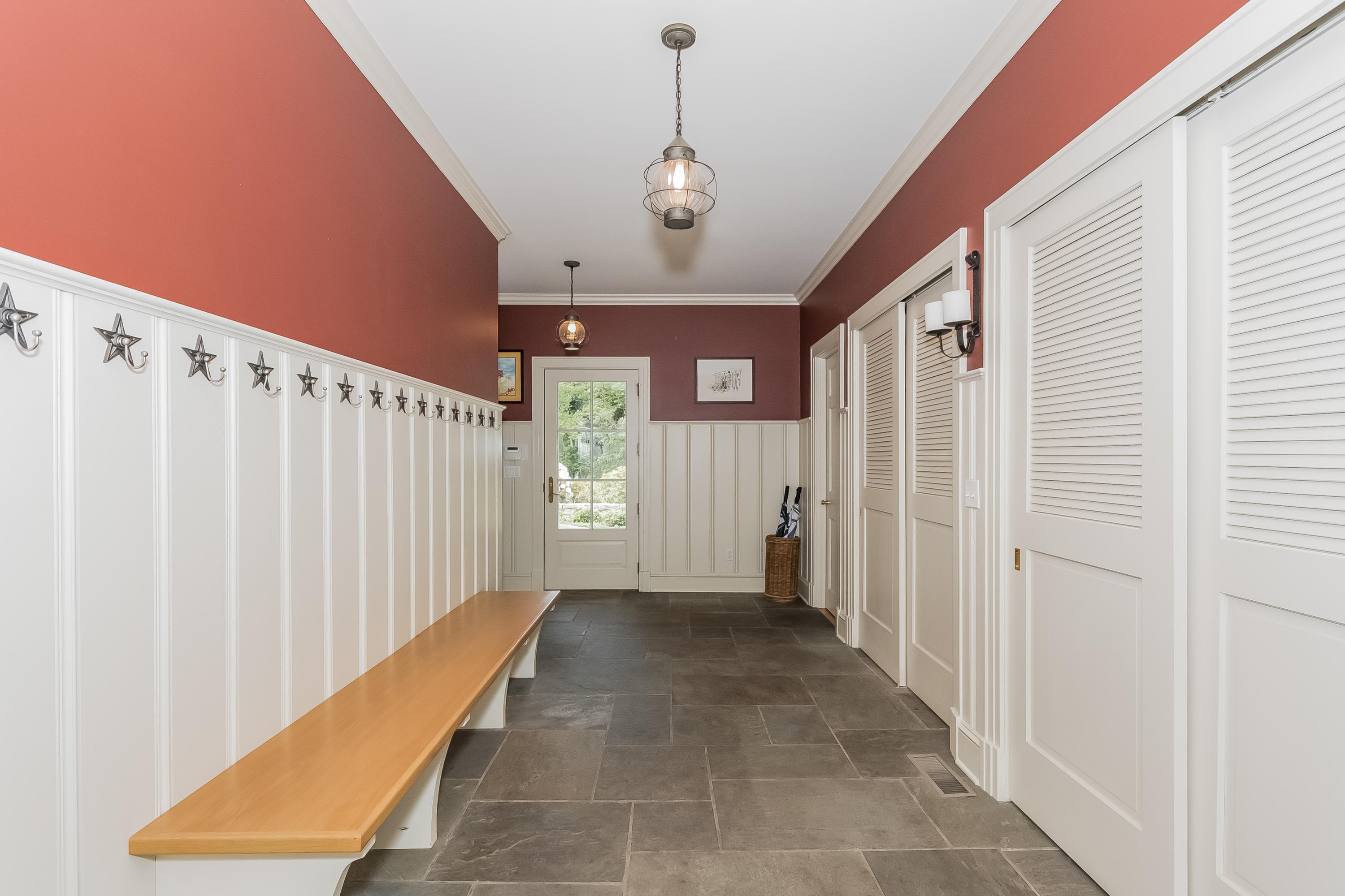 370 Wahackme Road New Canaan, CT 06840 - Photo 14 of 35 a view of a hallway with windows