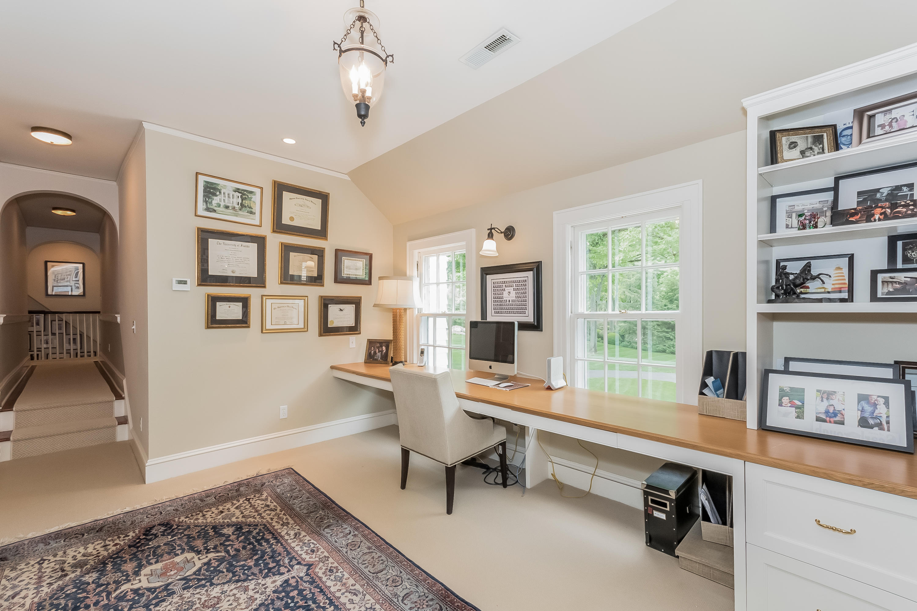 370 Wahackme Road New Canaan, CT 06840 - Photo 19 of 35 a living room with furniture a rug and a window