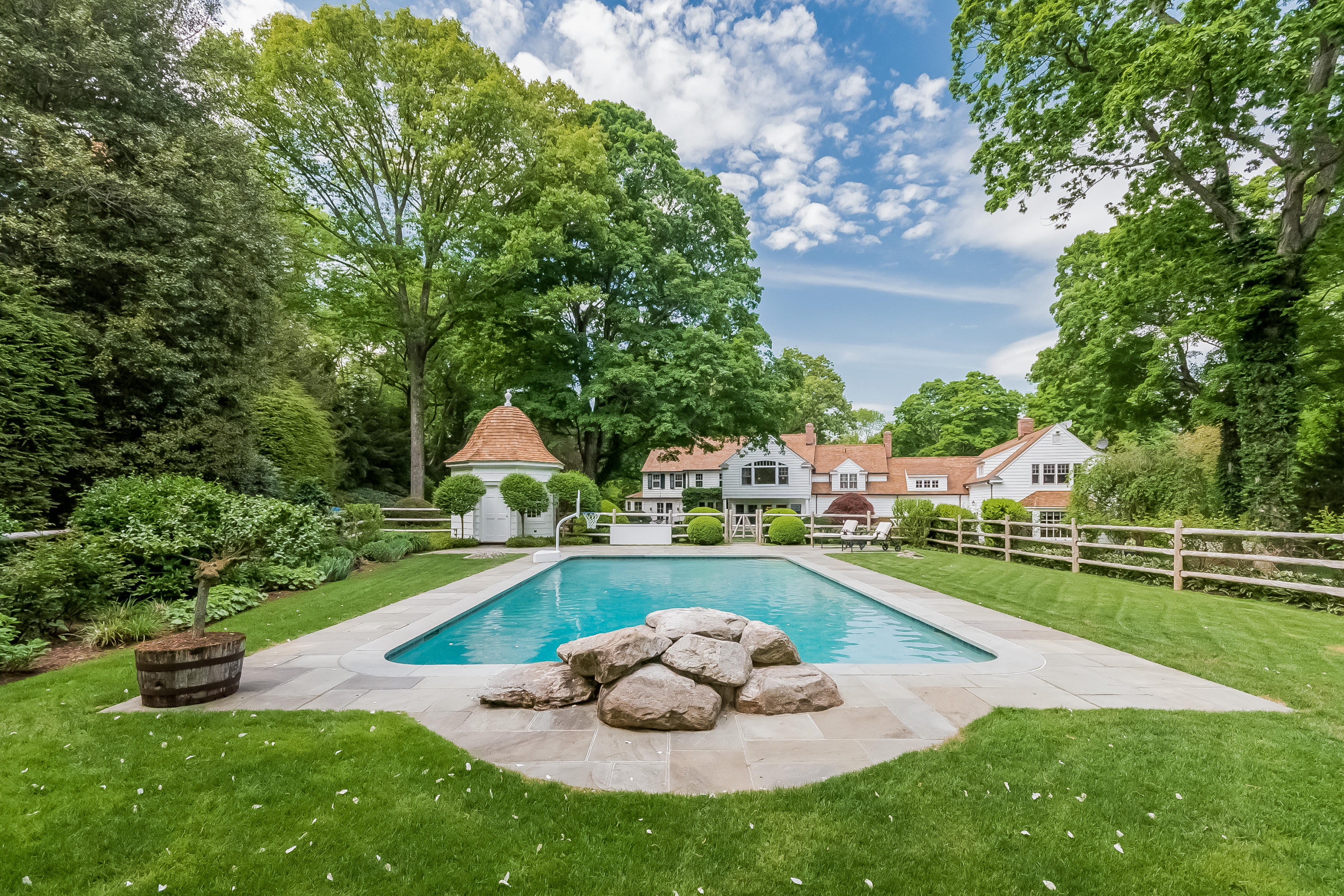 370 Wahackme Road New Canaan, CT 06840 - Photo 23 of 35 a view of a house with a yard and a patio