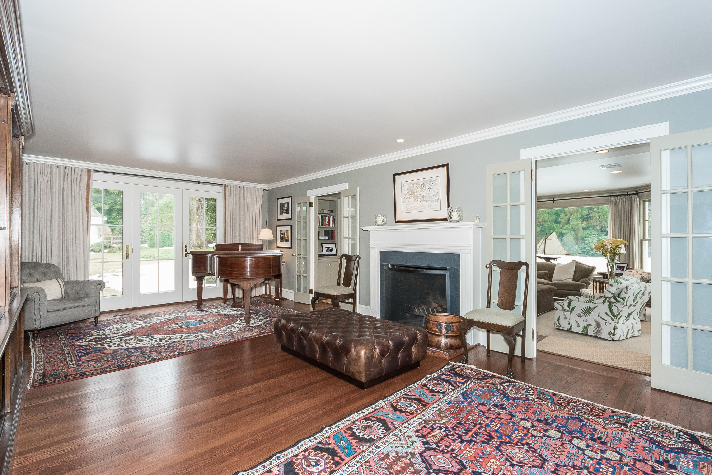 370 Wahackme Road New Canaan, CT 06840 - Photo 4 of 35 a living room with furniture and a fireplace