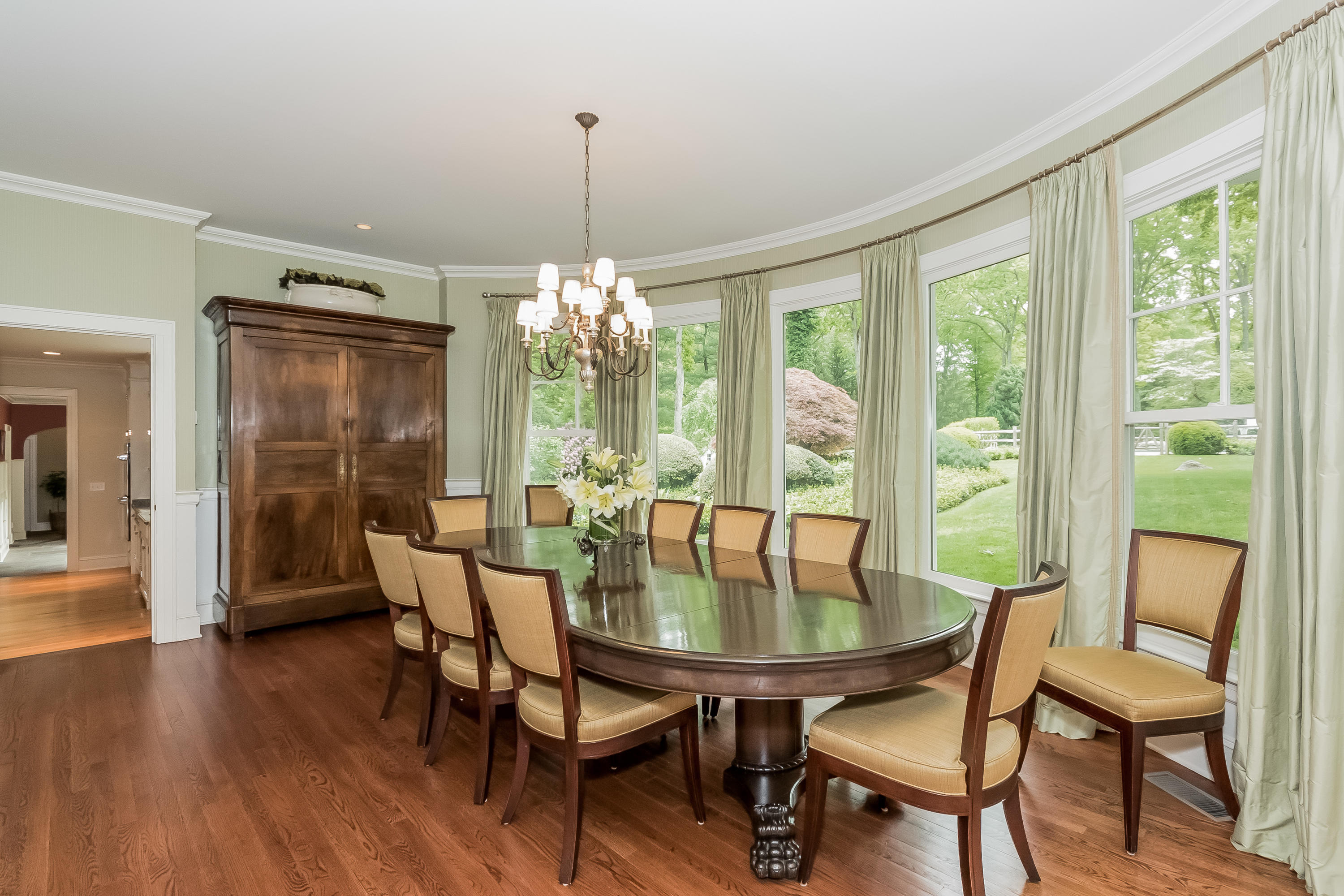 370 Wahackme Road New Canaan, CT 06840 - Photo 7 of 35 a view of a dining room with furniture window and wooden floor