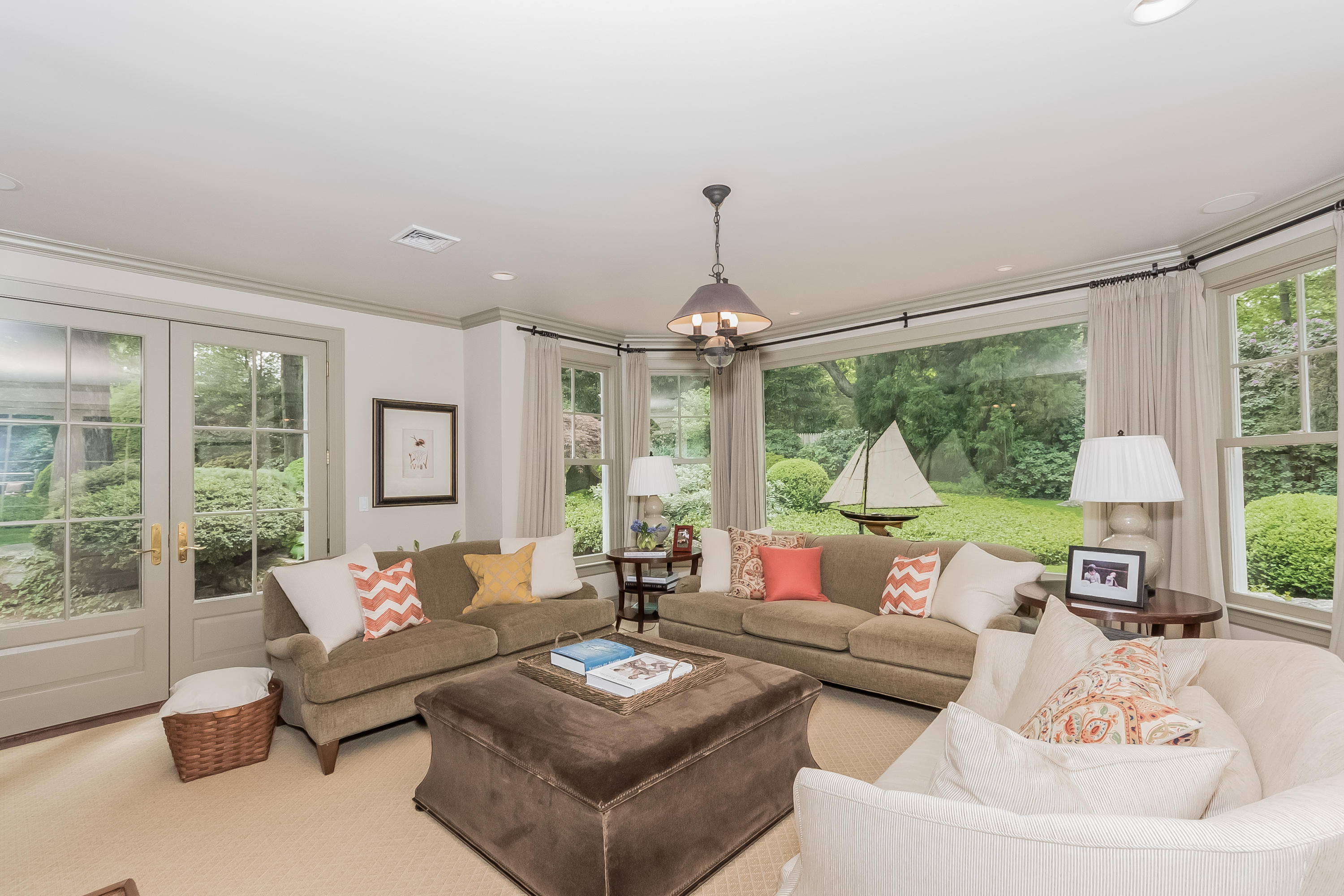 370 Wahackme Road New Canaan, CT 06840 - Photo 8 of 35 a living room with furniture and a large window