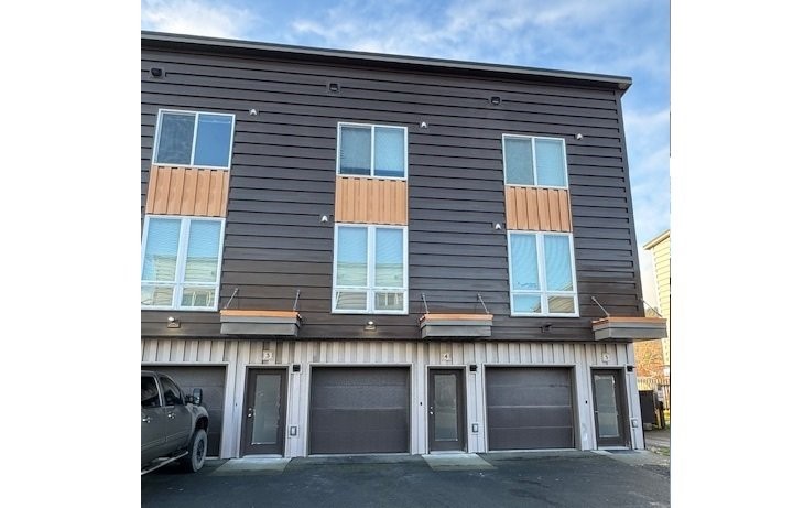 1223 Mill Bay Road Other, AK 99615 - Photo 2 of 8 a view of a house with a garage and balcony