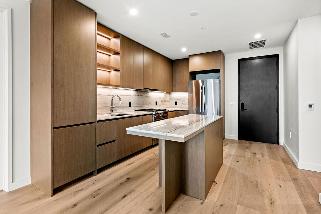 610 Davis Street, Unit 2504 Austin, TX 78701 - Photo 1 of 28 a kitchen with stainless steel appliances granite countertop a refrigerator a sink and a stove