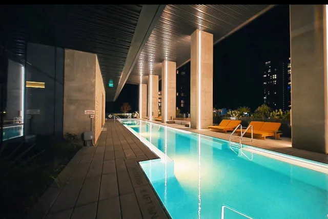 swimming pool view with a outdoor seating space