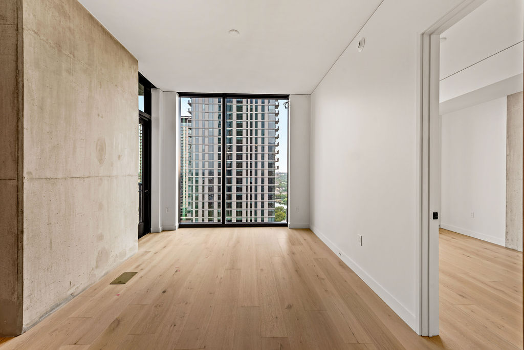 610 Davis Street, Unit 2504 Austin, TX 78701 - Photo 3 of 28 a view of a room with wooden floor and a window