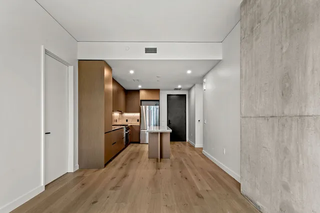 a view of a living room with a wooden floor