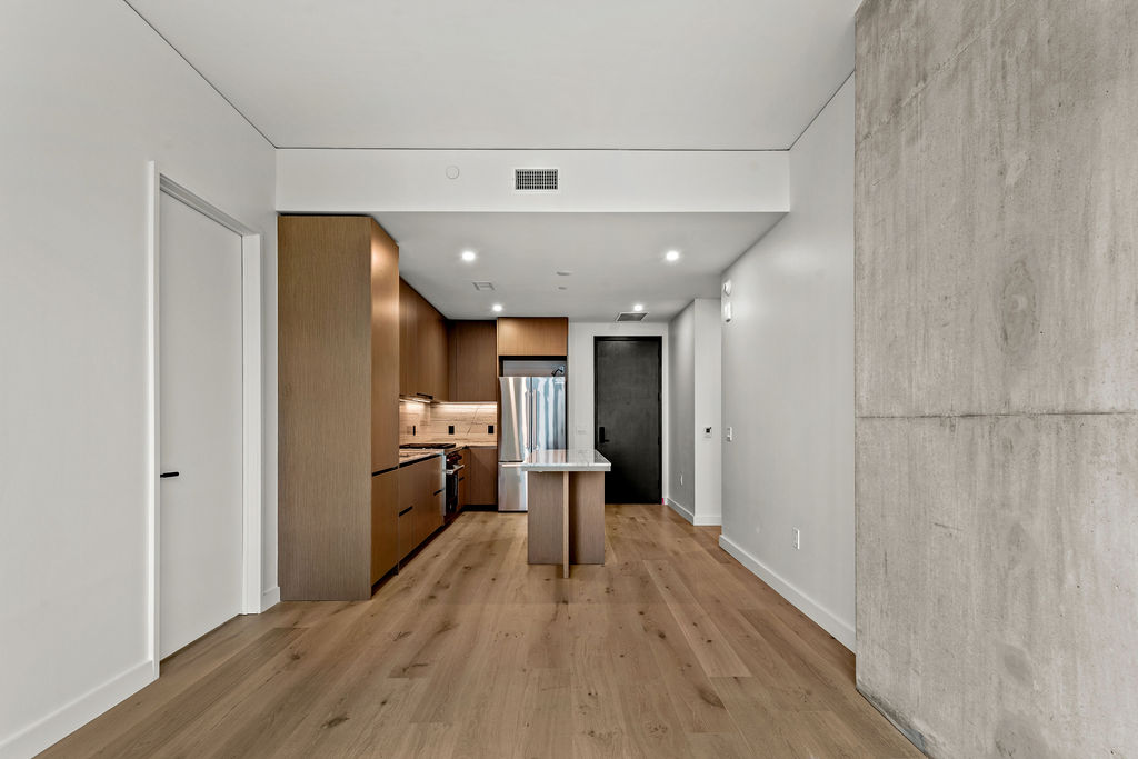 610 Davis Street, Unit 2504 Austin, TX 78701 - Photo 5 of 28 a view of a living room with a wooden floor