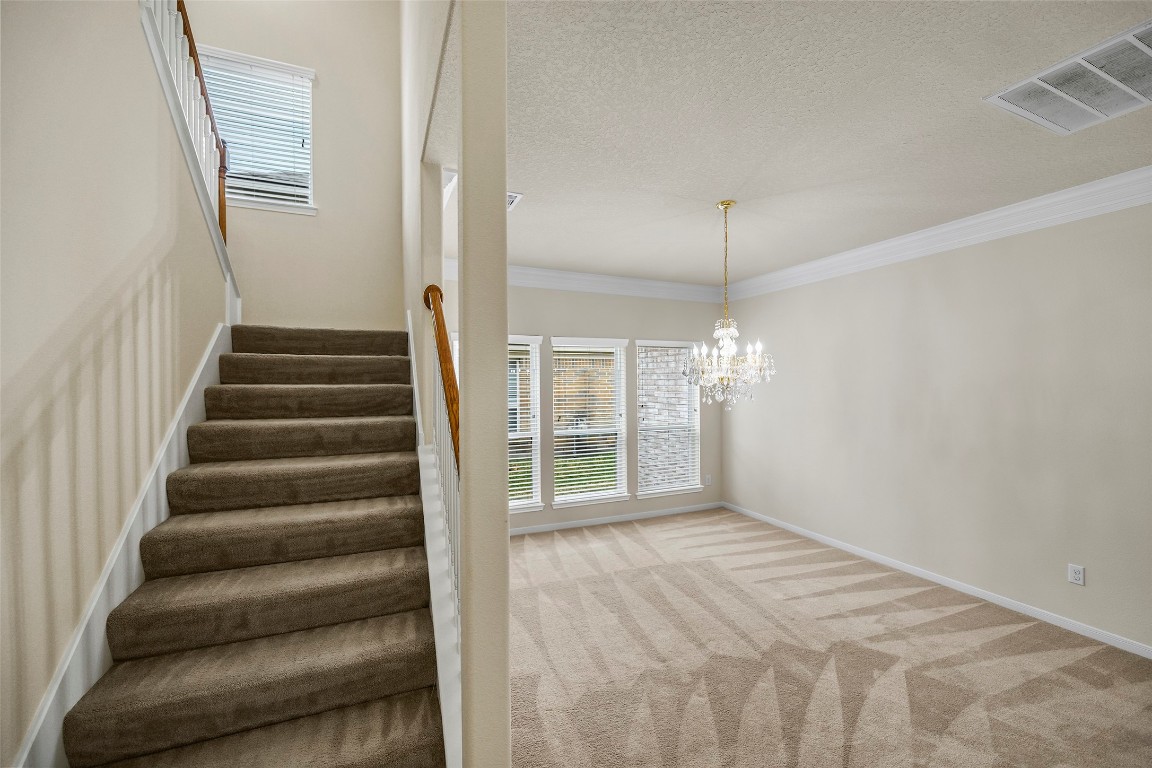 9934 Yearling Place Conroe, TX 77385 - Photo 20 of 47 Formal dining room, headed upstairs