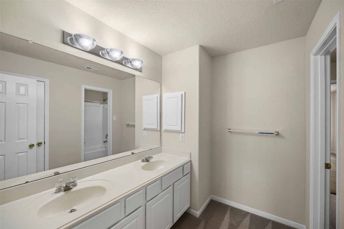 9934 Yearling Place Conroe, TX 77385 - Photo 28 of 47 Jack and Jill bathroom, with double sinks
