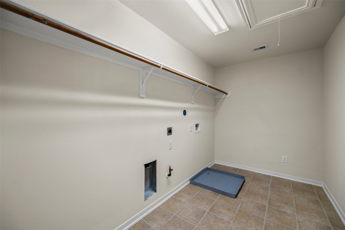 9934 Yearling Place Conroe, TX 77385 - Photo 37 of 47 Huge laundry room with both gas and electric dryer connections