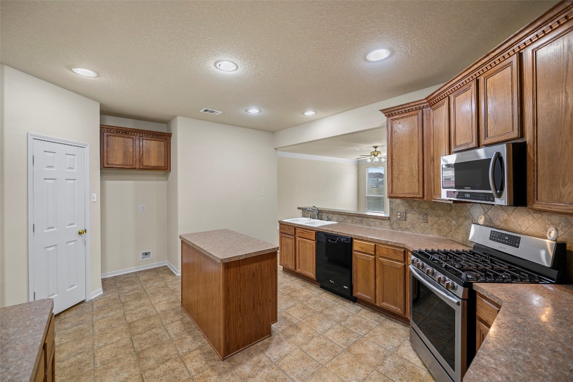 9934 Yearling Place Conroe, TX 77385 - Photo 6 of 47 Kitchen from formal dining room