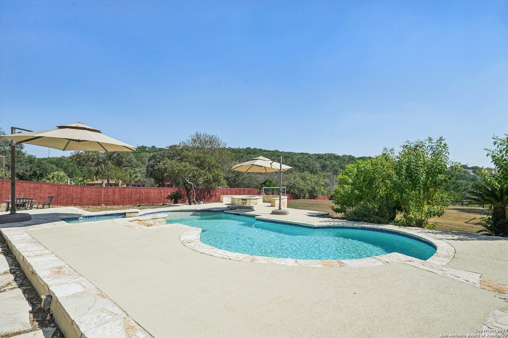 718 Ruidosa Downs Helotes, TX 78023 - Photo 2 of 50 a view of a swimming pool and outdoor space