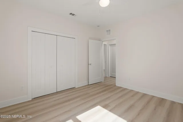 a view of a backyard with palm trees