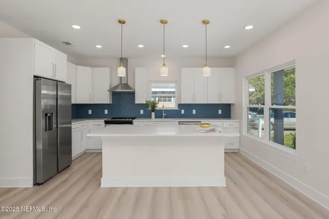 a kitchen with a sink and a stove