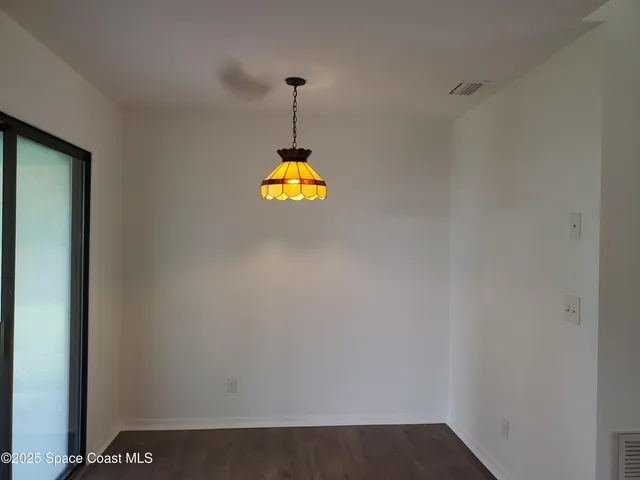 a view of a storage & utility room with a window
