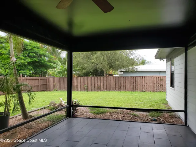 a view of a back yard from a big room