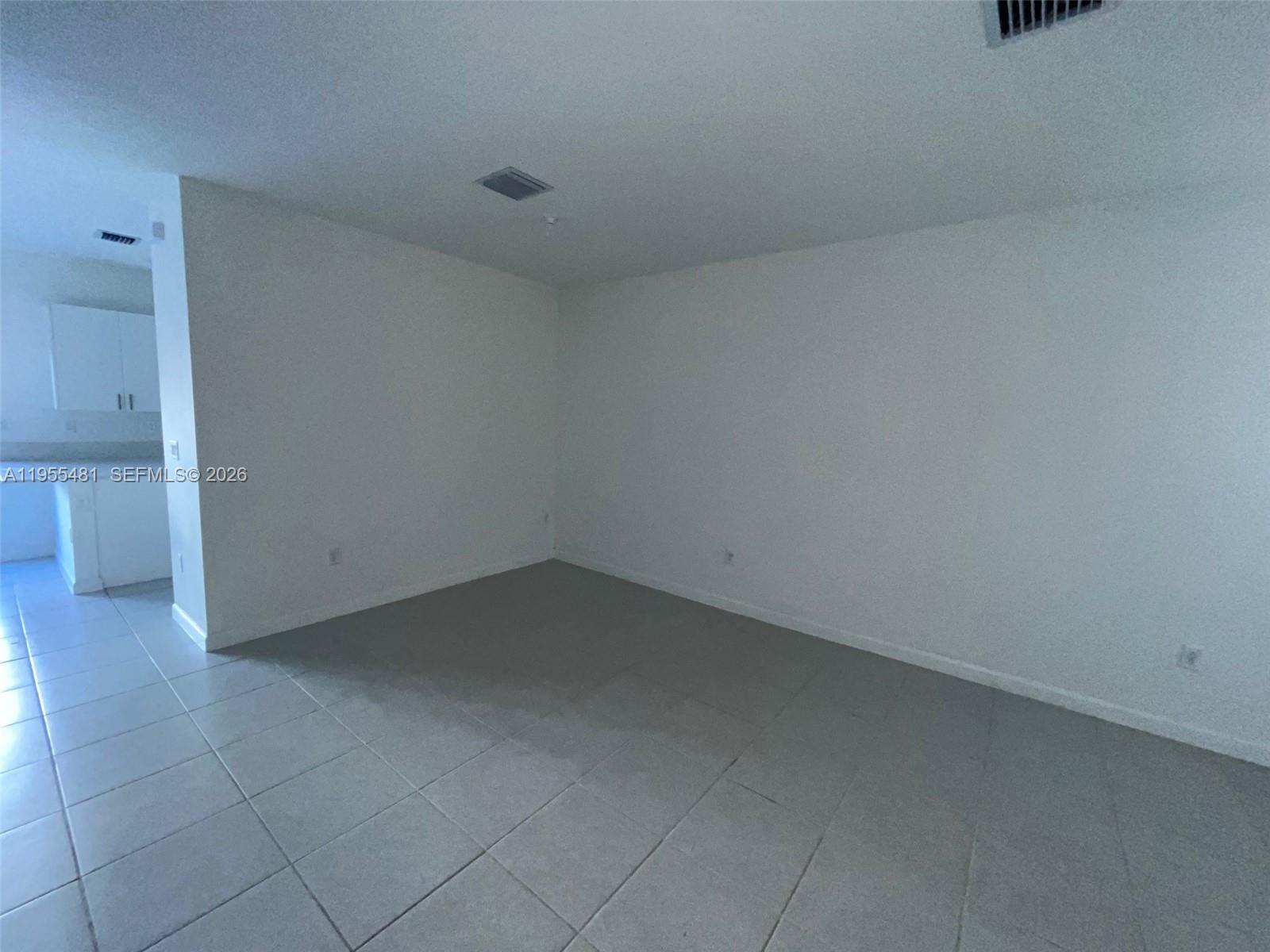 16243 Southwest 289th Street, Unit 16243 Homestead, FL 33033 - Photo 10 of 12 a view of an empty room