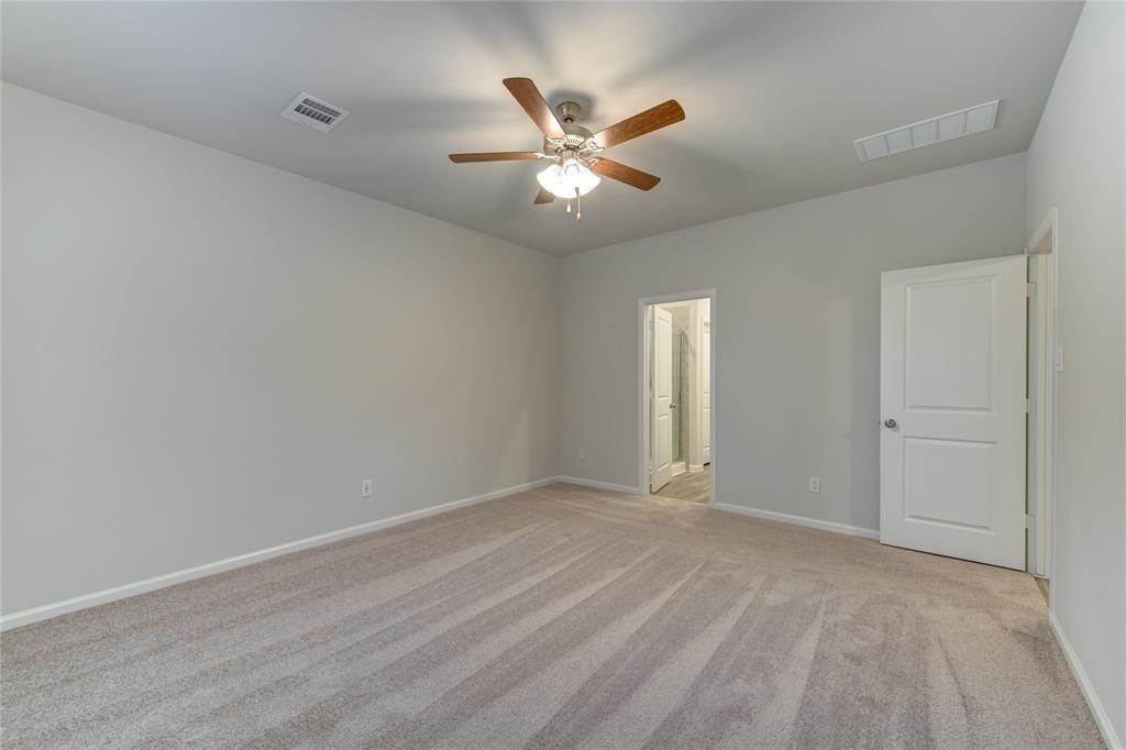 94 Valiant Ridge Trail Magnolia, TX 77354 - Photo 9 of 13 a view of an empty room and window
