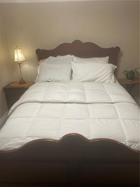 1525 Sloppy Floyd Lake Road Summerville, GA 30747 - Photo 6 of 17 a bedroom with a bed and a night stand