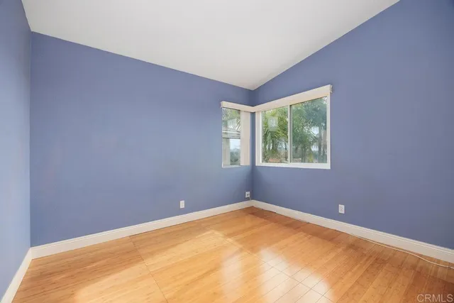 a view of a big room with windows