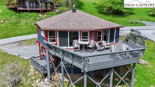 an outdoor space with furniture and garden