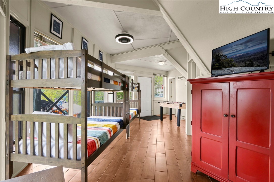 104 Longview Court Seven Devils, NC 28604 - Photo 25 of 46 a hallway with furniture and a flat screen tv