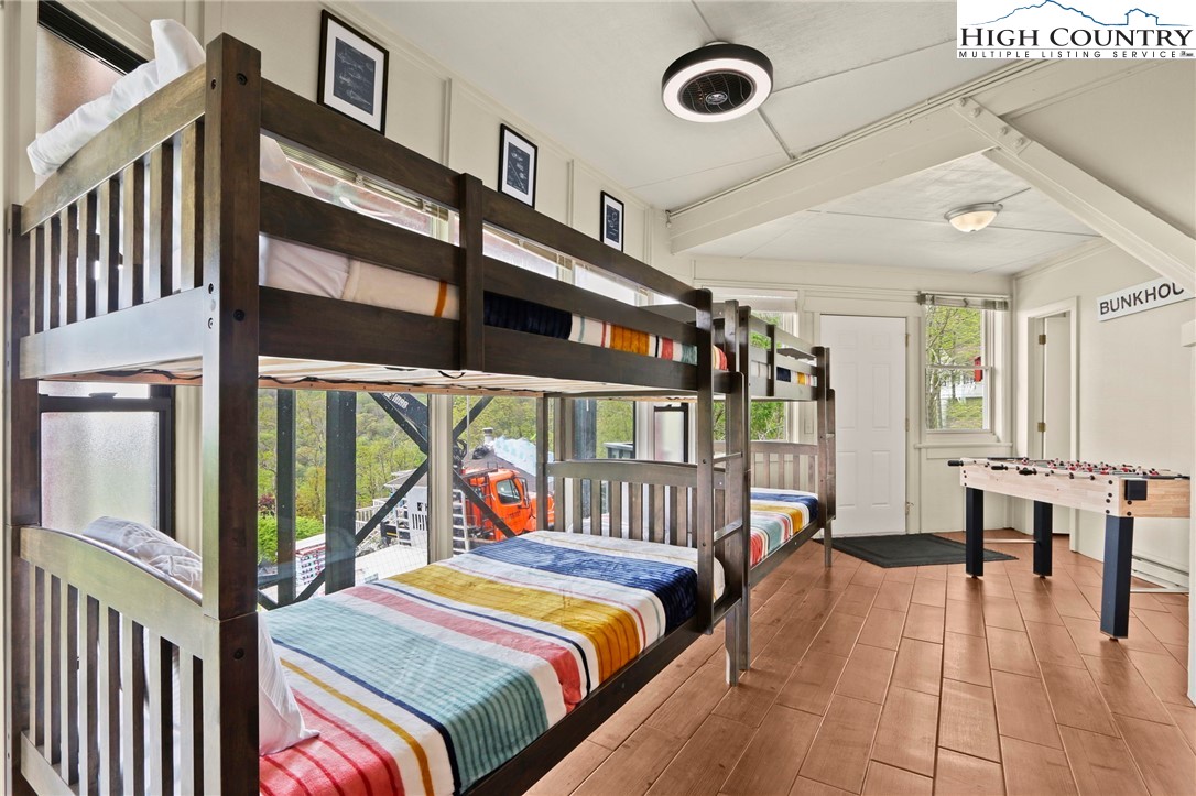 104 Longview Court Seven Devils, NC 28604 - Photo 26 of 46 a bedroom with furniture and a window