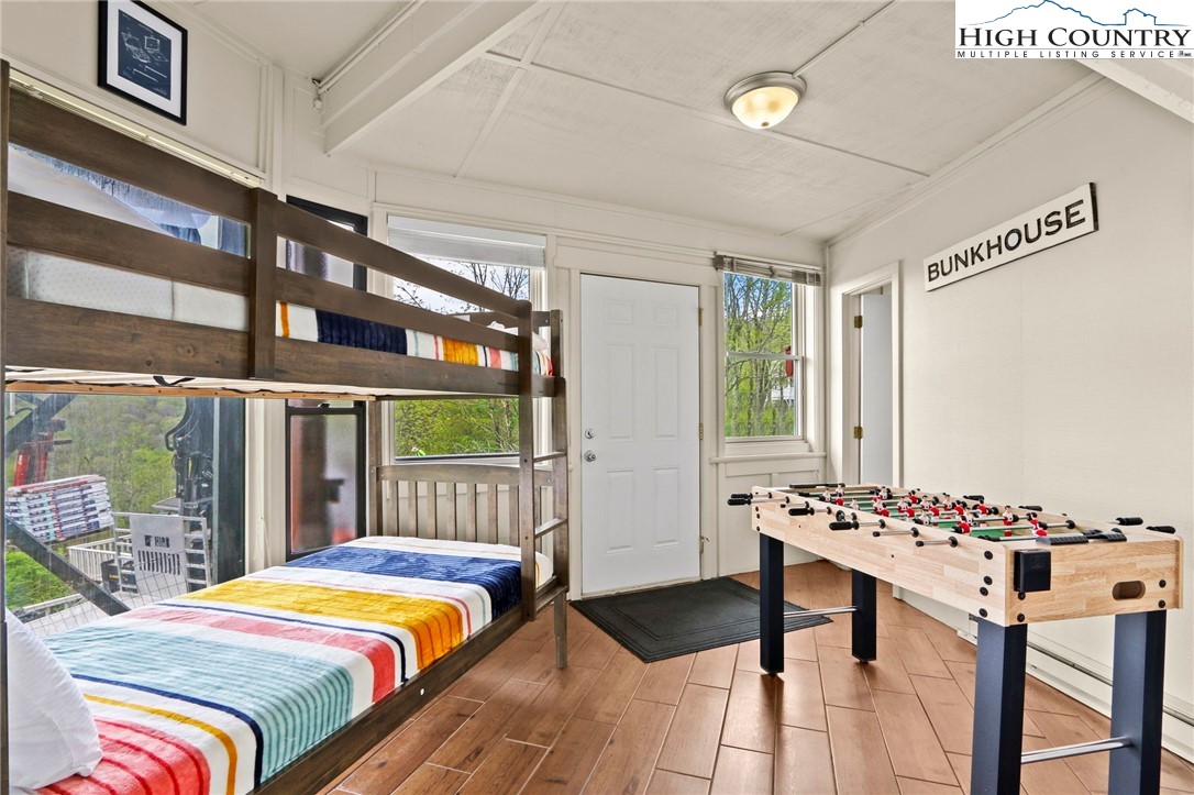 104 Longview Court Seven Devils, NC 28604 - Photo 27 of 46 a bedroom with a bed and a table