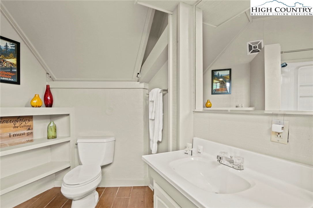 104 Longview Court Seven Devils, NC 28604 - Photo 29 of 46 a bathroom with a sink toilet and a mirror