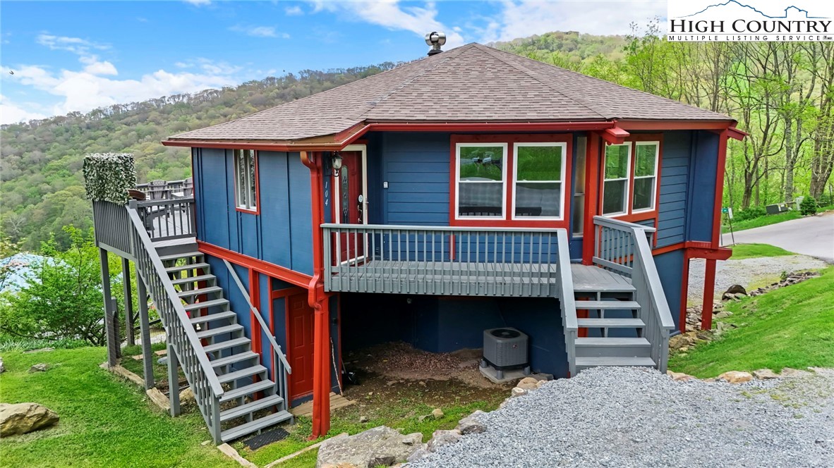 104 Longview Court Seven Devils, NC 28604 - Photo 3 of 46 a front view of a house with balcony and stairs