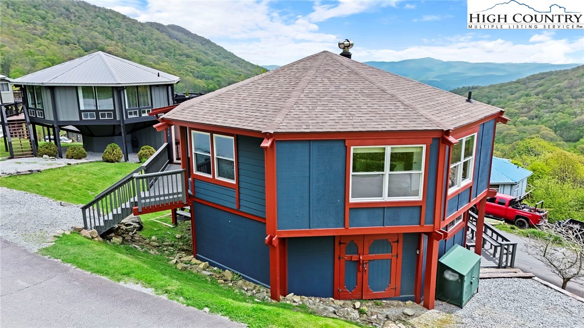 104 Longview Court Seven Devils, NC 28604 - Photo 42 of 46 a front view of house with yard and trees