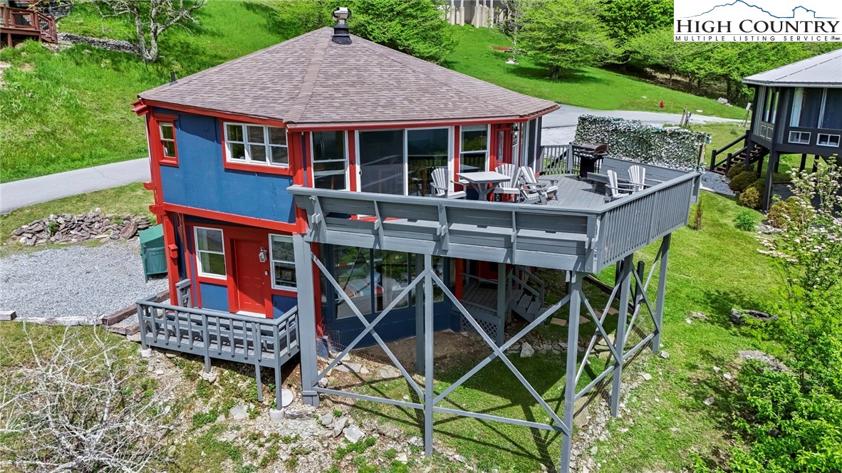 104 Longview Court Seven Devils, NC 28604 - Photo 44 of 46 a view of a house with backyard and porch