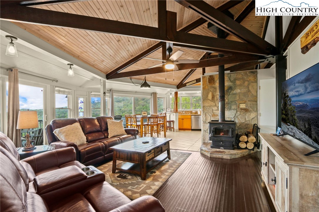 104 Longview Court Seven Devils, NC 28604 - Photo 5 of 46 a living room with furniture and a flat screen tv