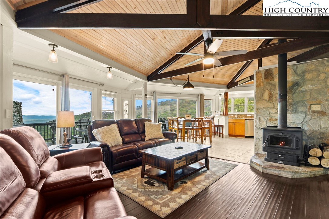 104 Longview Court Seven Devils, NC 28604 - Photo 6 of 46 a living room with furniture and a large window