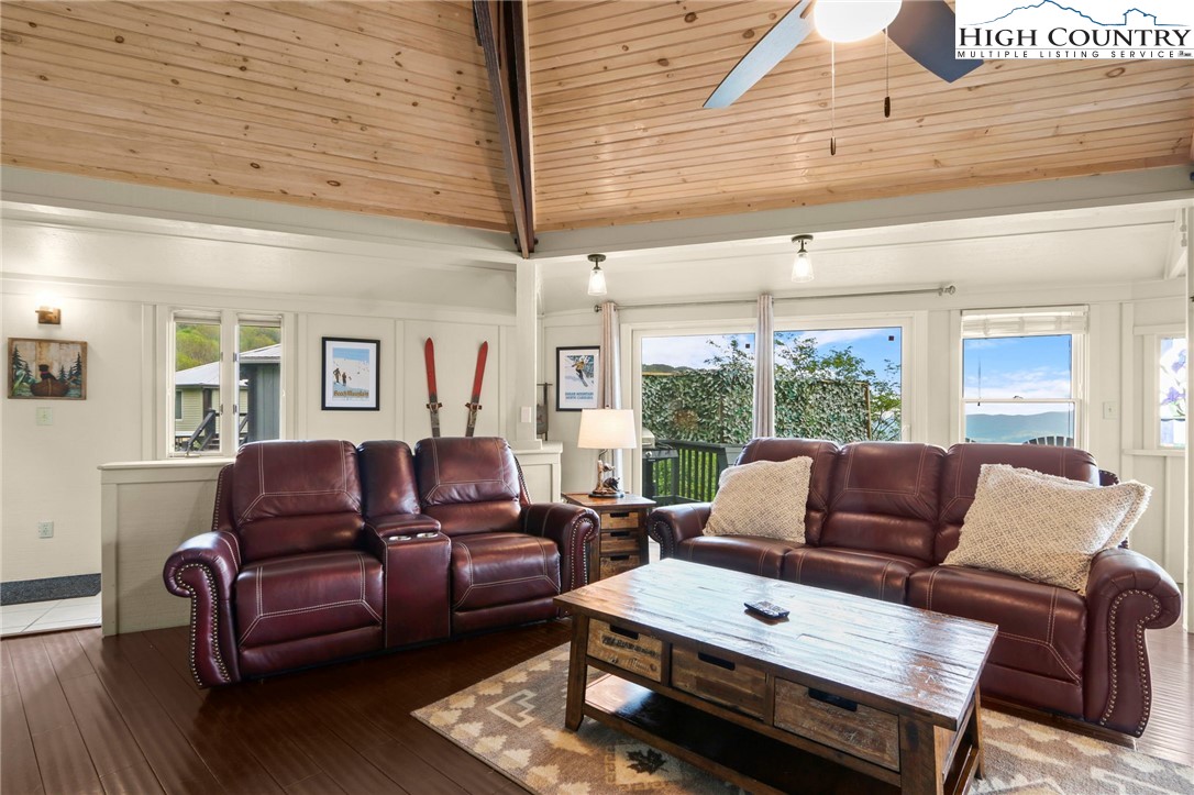 104 Longview Court Seven Devils, NC 28604 - Photo 7 of 46 a living room with furniture and a window