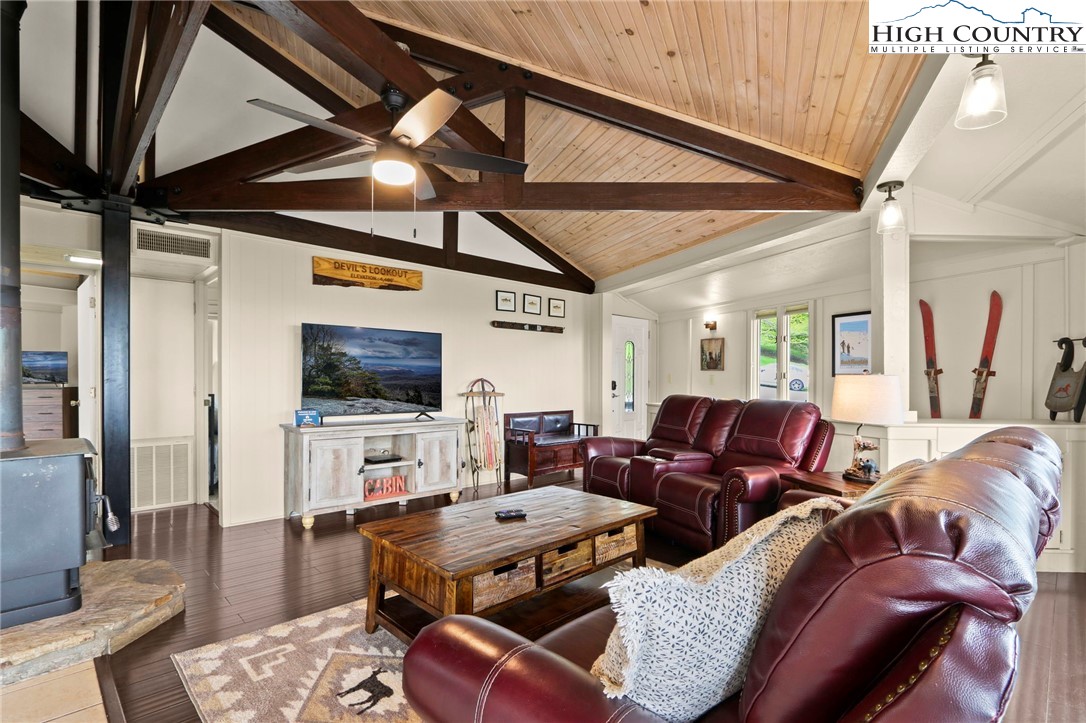 104 Longview Court Seven Devils, NC 28604 - Photo 8 of 46 a living room with furniture and a flat screen tv