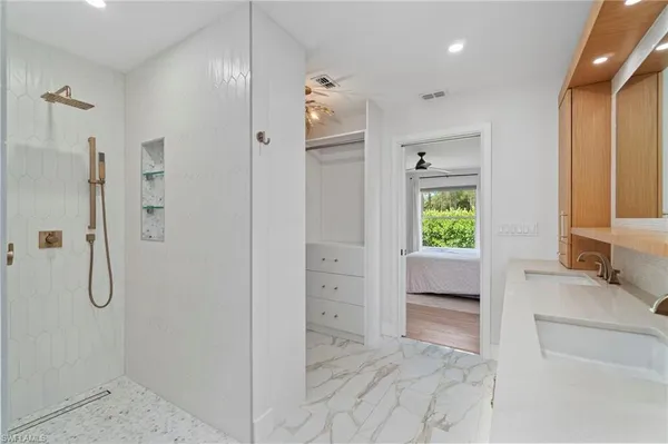 a bathroom with a tub and shower
