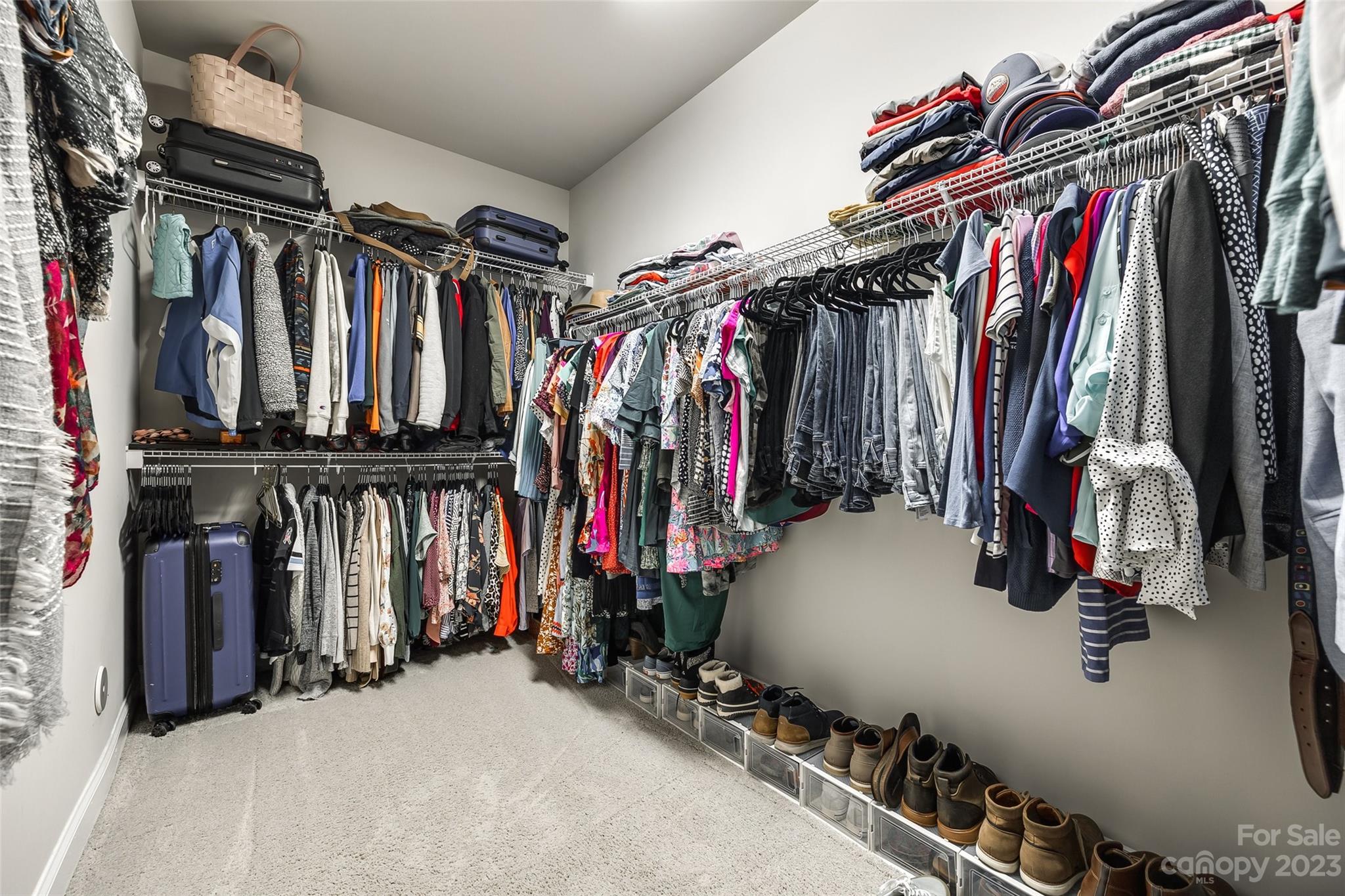201 Helton Lane Fort Mill, SC 29708 - Photo 12 of 47 a view of walk in closet with clothes and shoes