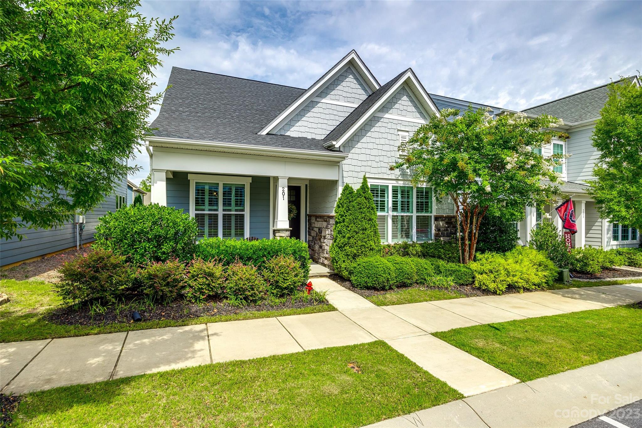 201 Helton Lane Fort Mill, SC 29708 - Photo 33 of 47 a front view of a house with a yard and potted plants