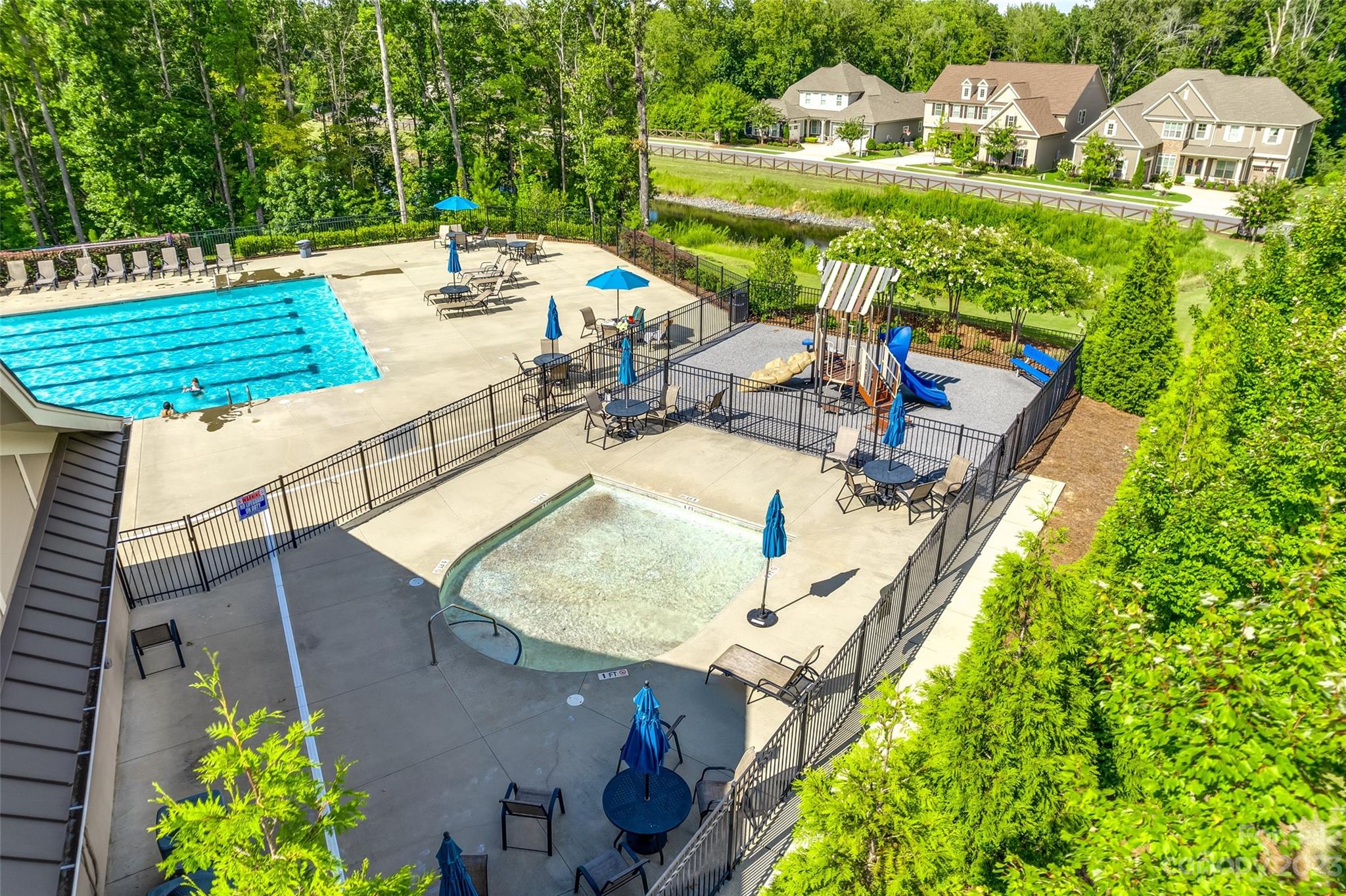 201 Helton Lane Fort Mill, SC 29708 - Photo 44 of 47 a view of a swimming pool with a patio and plants